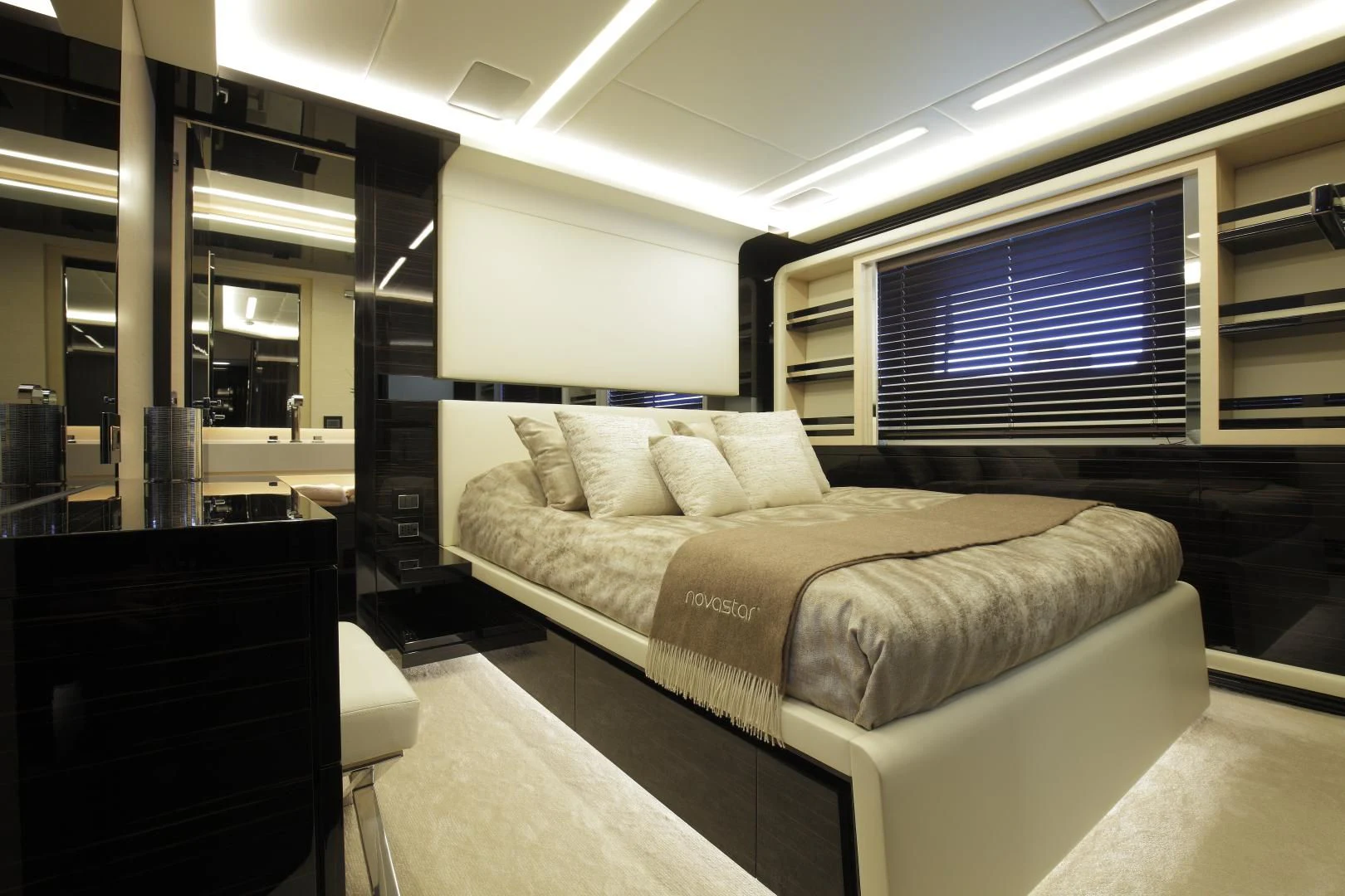 a large bed in a room aboard NOVASTAR Yacht for Sale