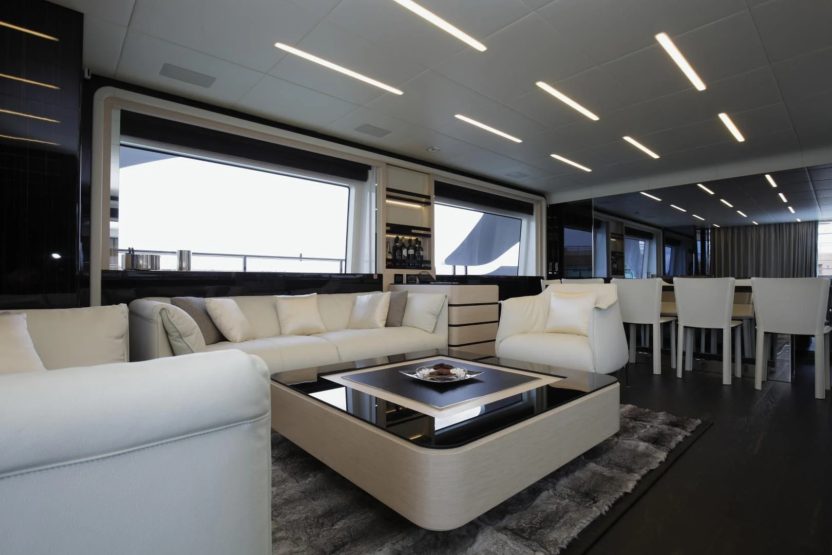 a room with a couch and a table and a tv aboard NOVASTAR Yacht for Sale