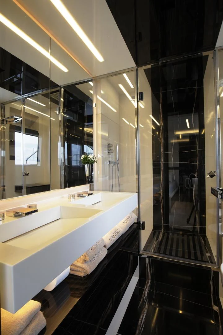 a bathroom with a large mirror aboard NOVASTAR Yacht for Sale