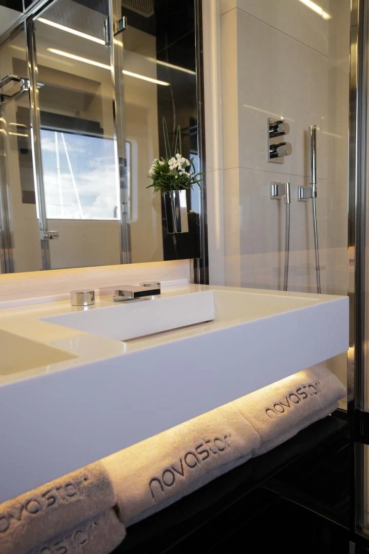 a bathroom with a large mirror aboard NOVASTAR Yacht for Sale
