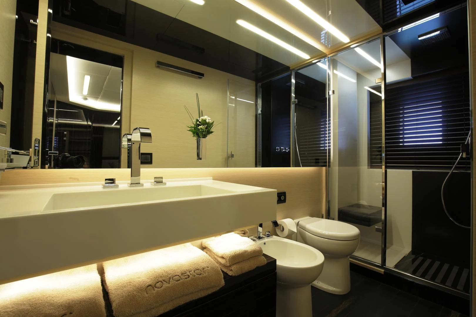 a bathroom with a tub sink and toilet aboard NOVASTAR Yacht for Sale