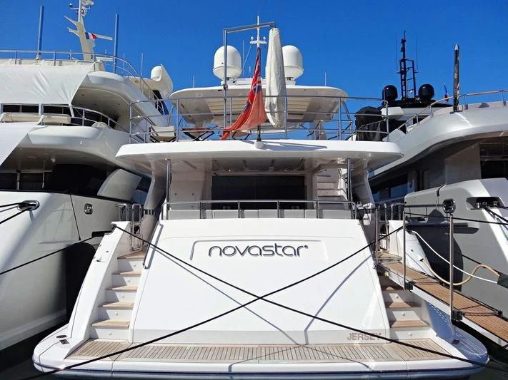 a white yacht docked aboard NOVASTAR Yacht for Sale