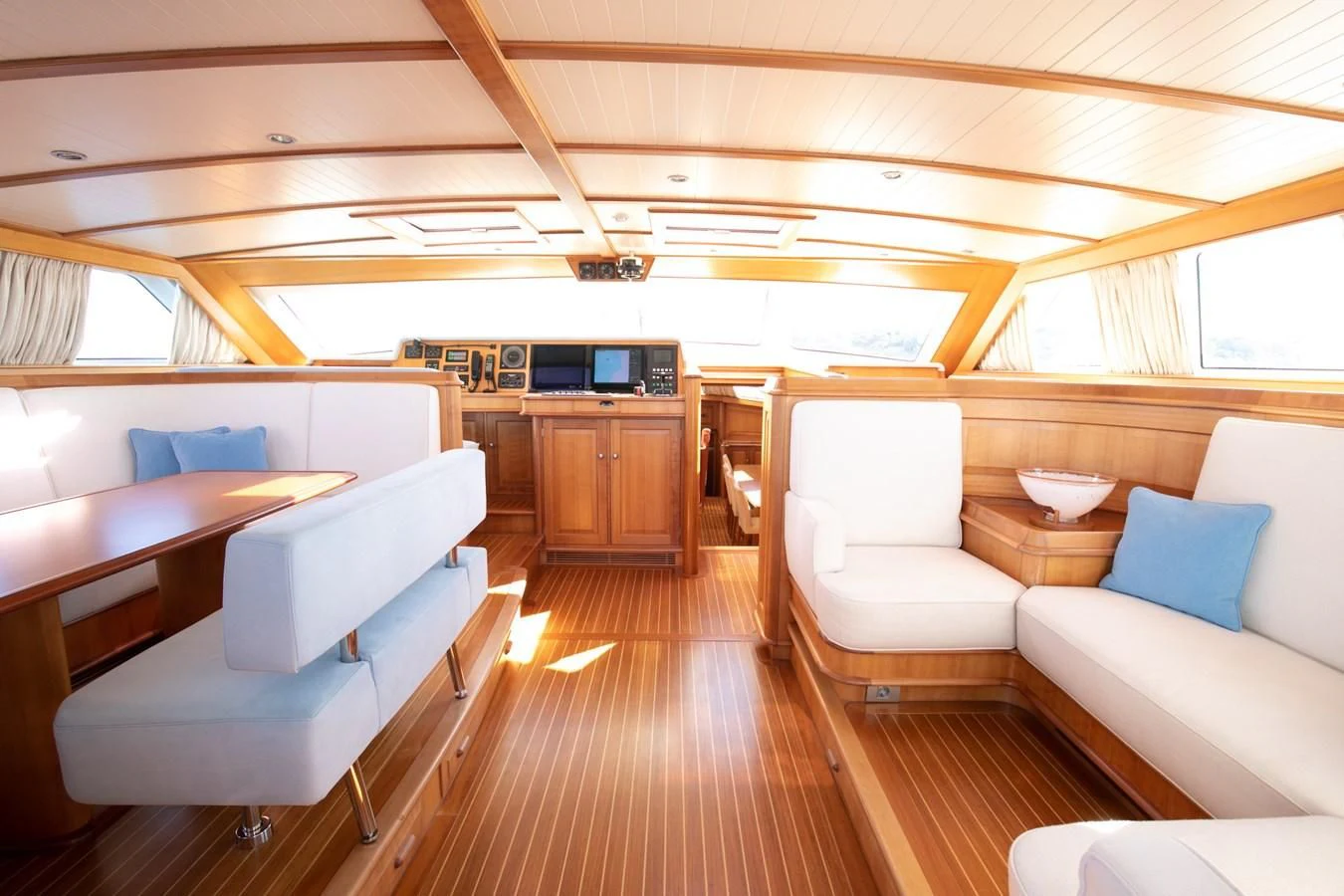 a living room with a wood floor aboard PITUXIN VI Yacht for Sale