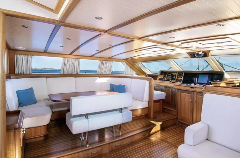 a room with a couch and a table aboard PITUXIN VI Yacht for Sale