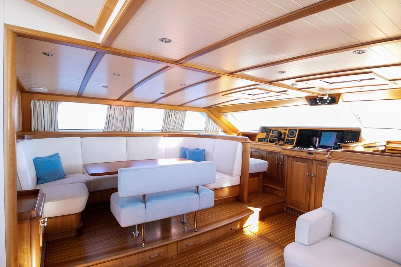 a room with a couch and a table aboard PITUXIN VI Yacht for Sale