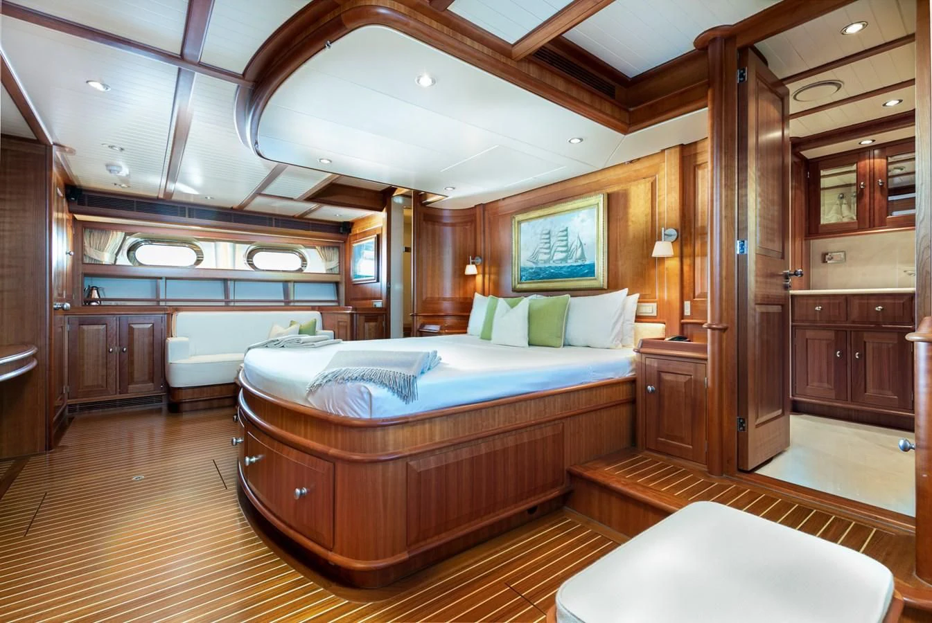 a large bedroom with a bed aboard PITUXIN VI Yacht for Sale