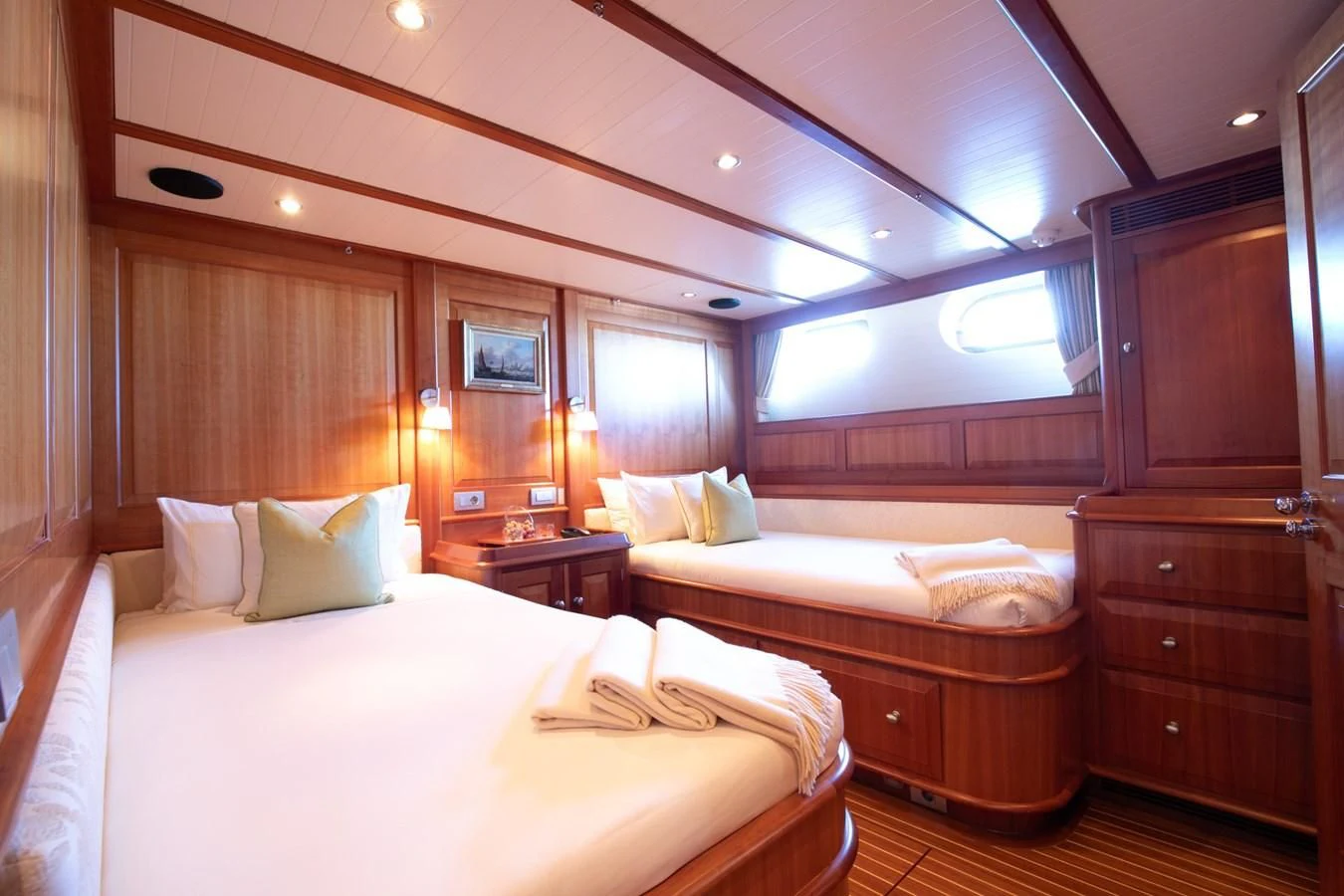 a room with two beds aboard PITUXIN VI Yacht for Sale