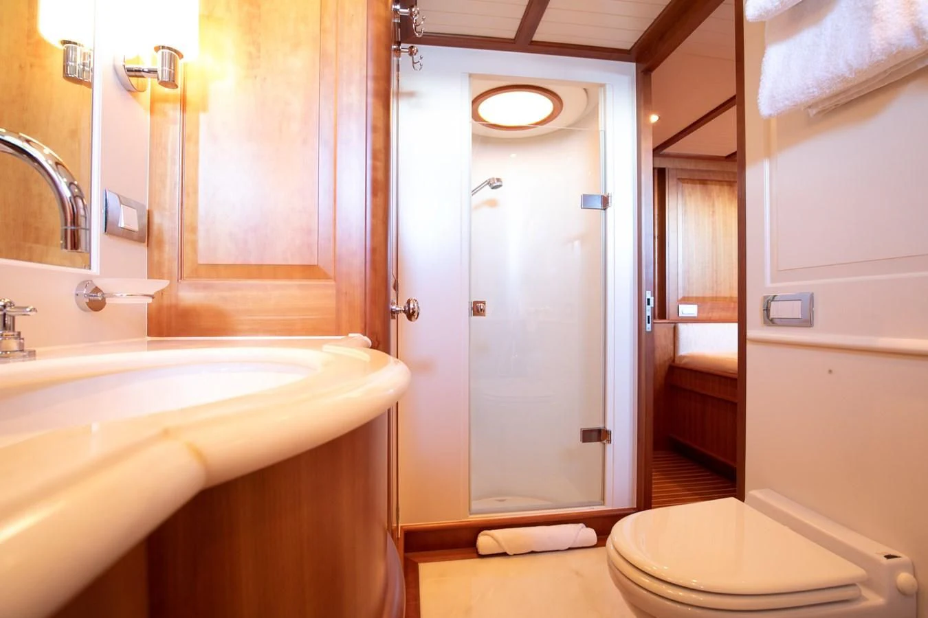 a bathroom with a shower and sink aboard PITUXIN VI Yacht for Sale