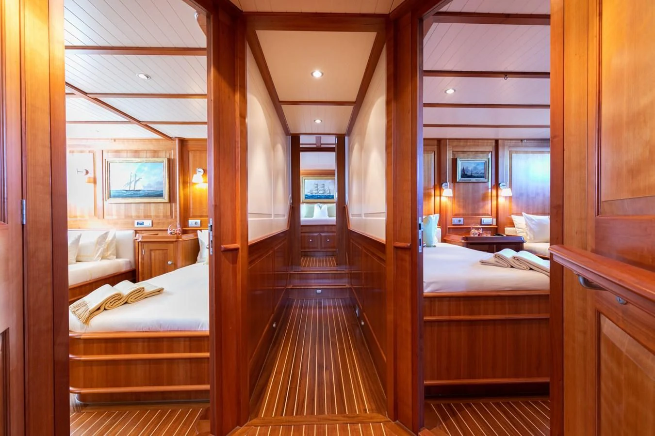 a room with a wood floor and a wood door aboard PITUXIN VI Yacht for Sale
