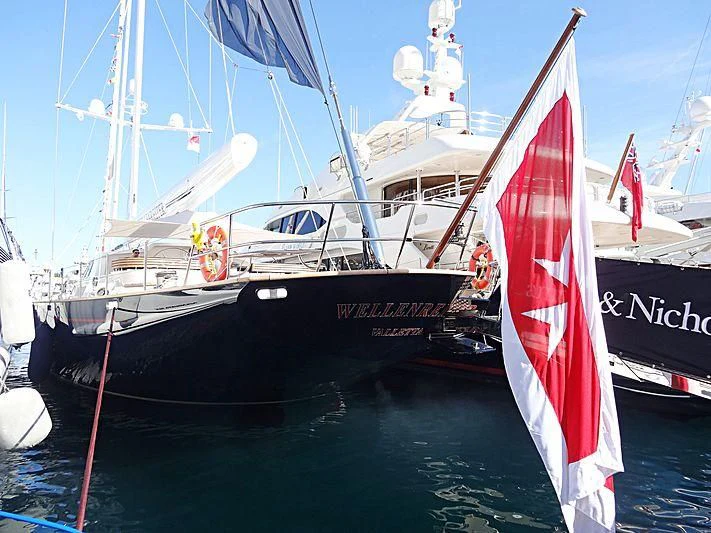 a boat with a flag on it aboard PITUXIN VI Yacht for Sale