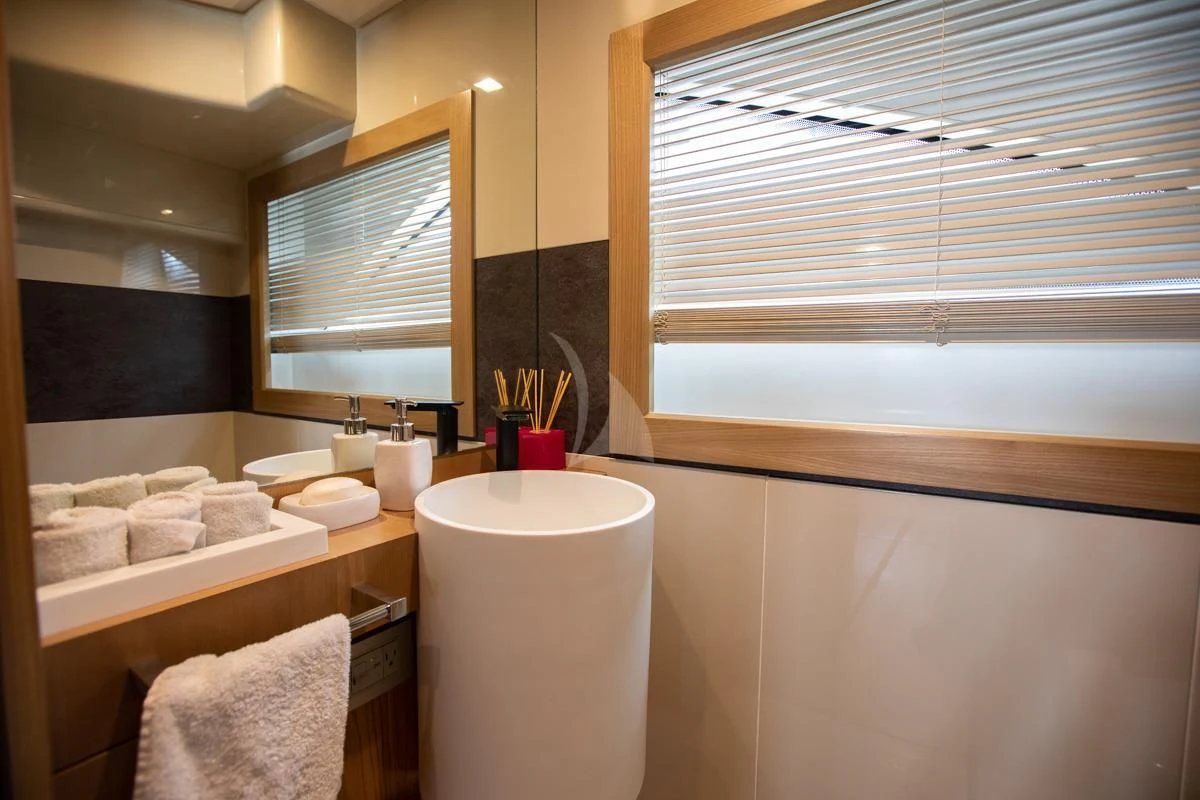 a bathroom with a large window aboard NIKO III Yacht for Charter