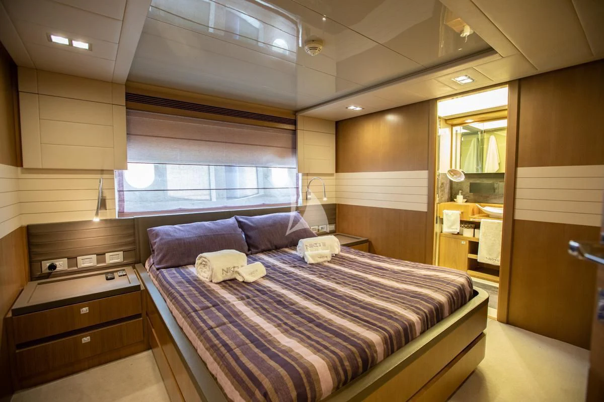 a bed in a room aboard NIKO III Yacht for Charter
