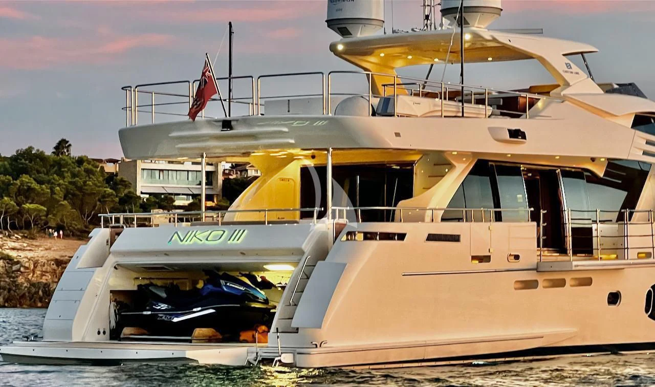 a boat docked at a pier aboard NIKO III Yacht for Charter