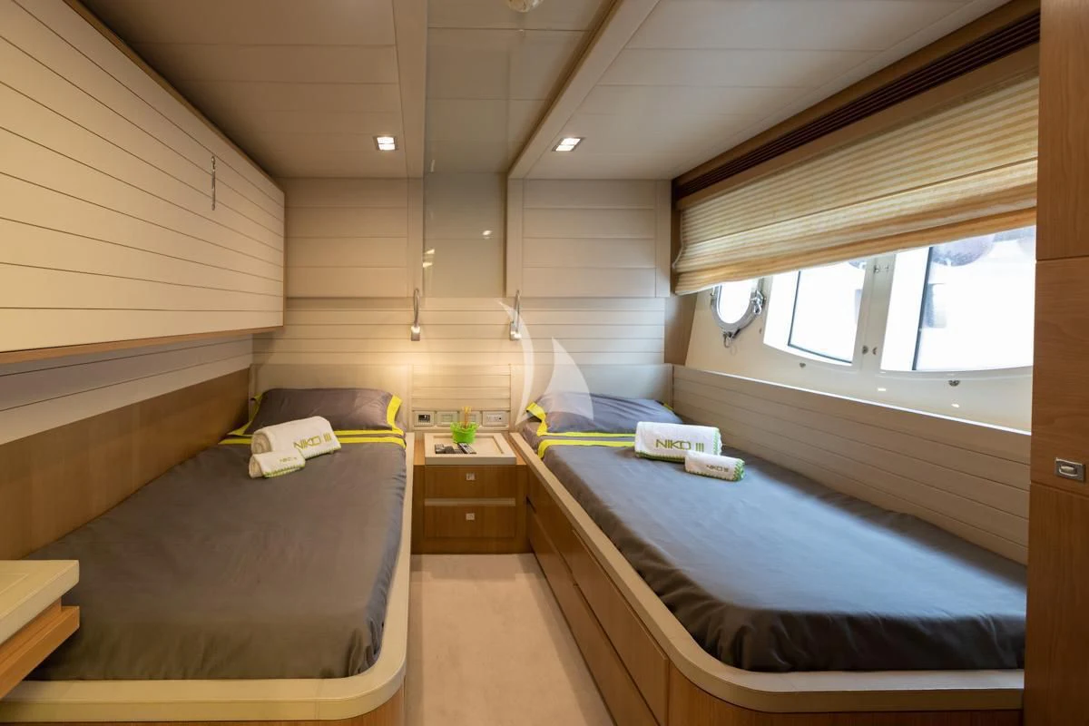 a room with bunk beds aboard NIKO III Yacht for Charter