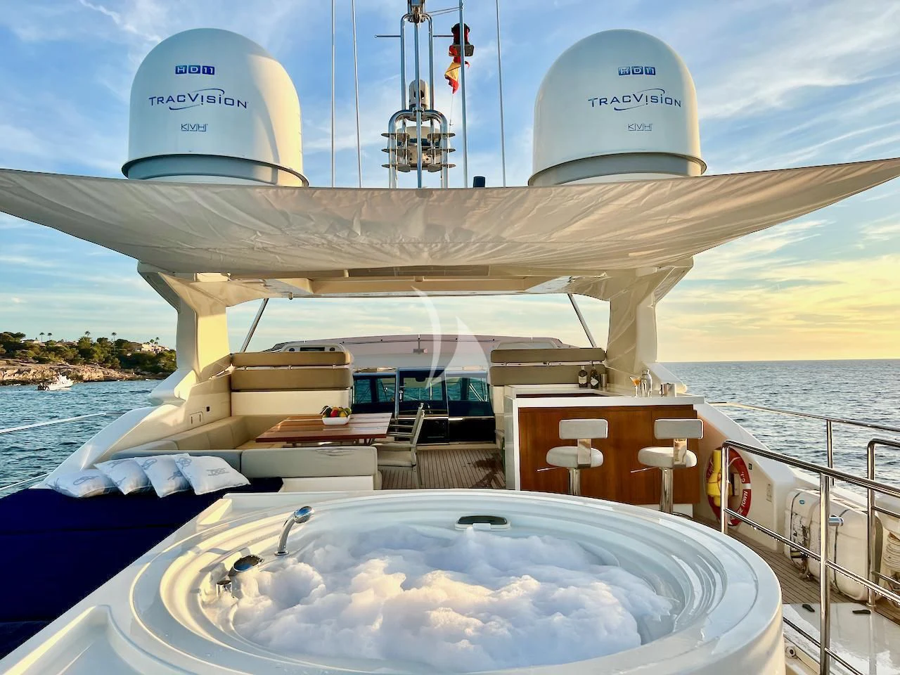 a large white ship with a satellite dish on it aboard NIKO III Yacht for Charter