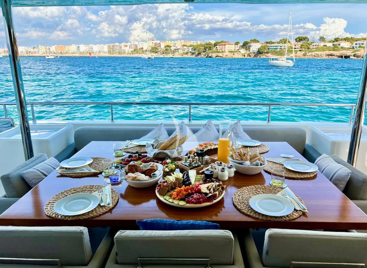 a table with food on it aboard NIKO III Yacht for Charter