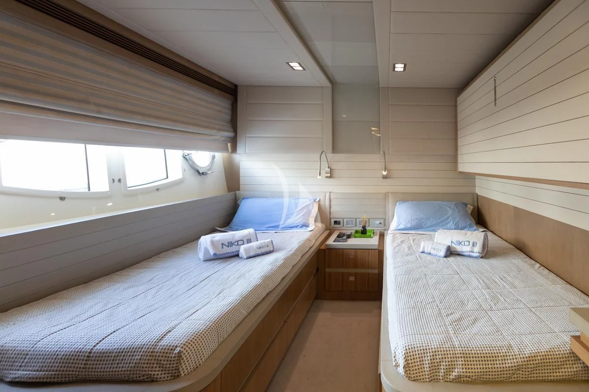 a room with two beds aboard NIKO III Yacht for Charter