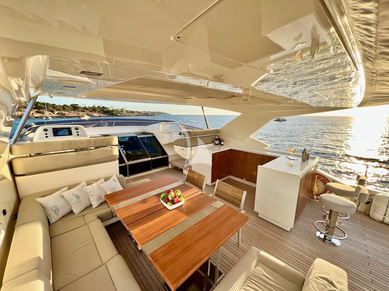 a boat with a table and chairs aboard NIKO III Yacht for Charter