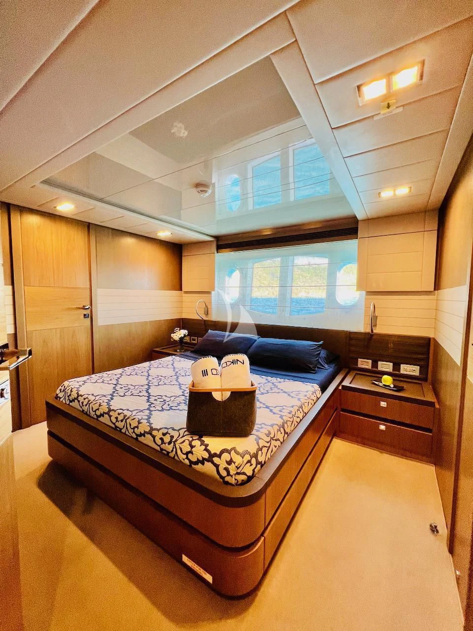 a bed in a room aboard NIKO III Yacht for Charter