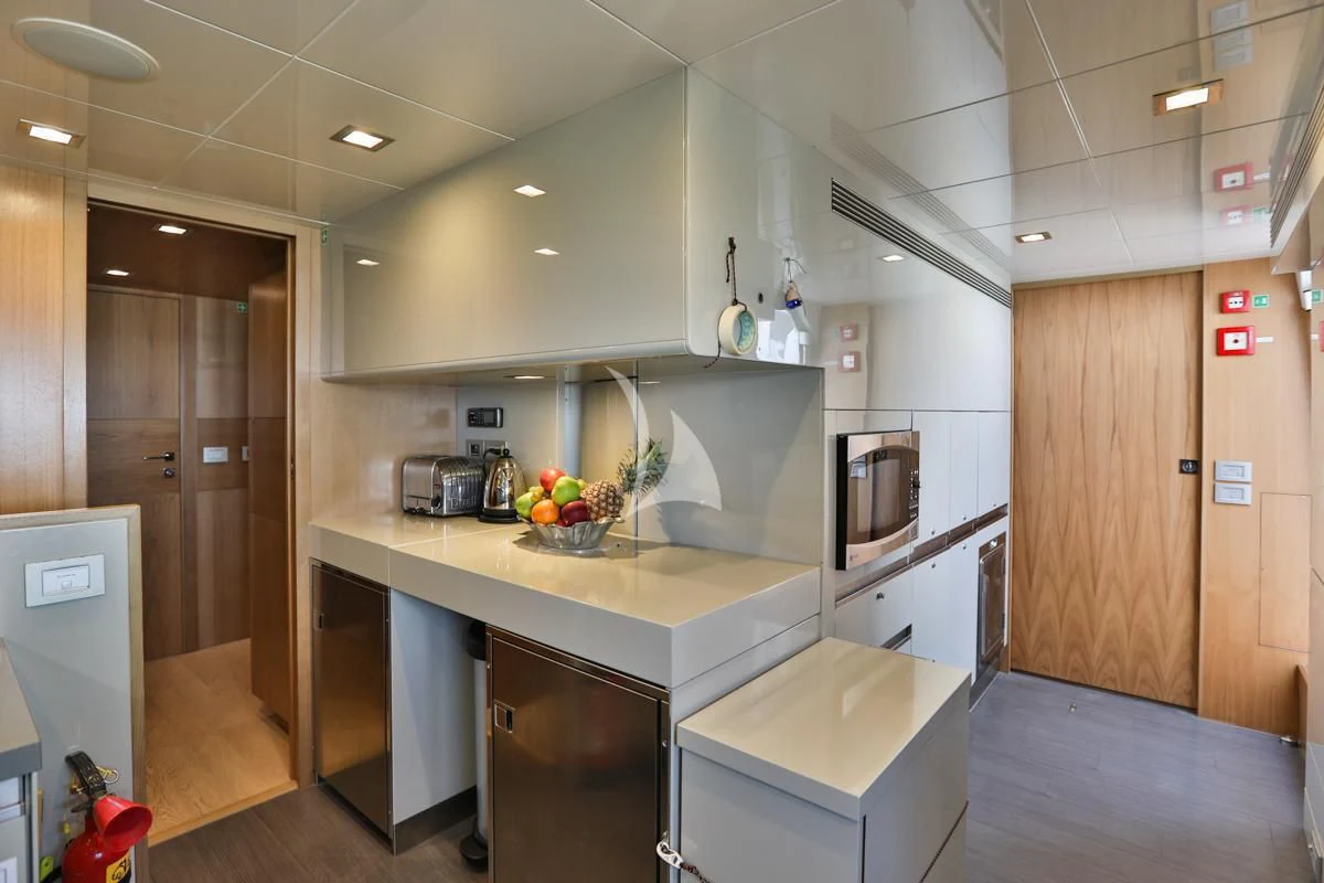 a kitchen with a countertop aboard NIKO III Yacht for Charter