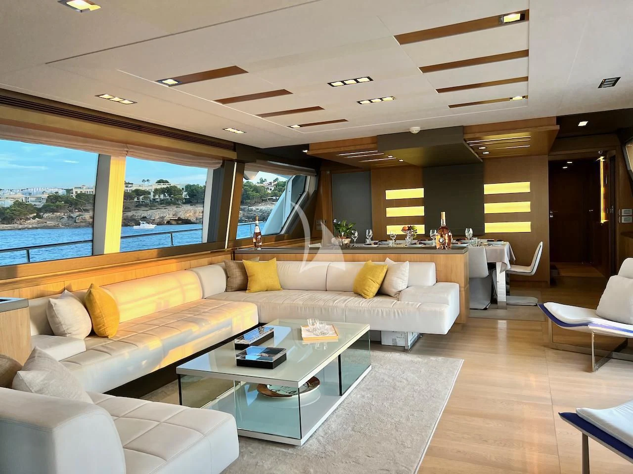 a living room with a large window aboard NIKO III Yacht for Charter