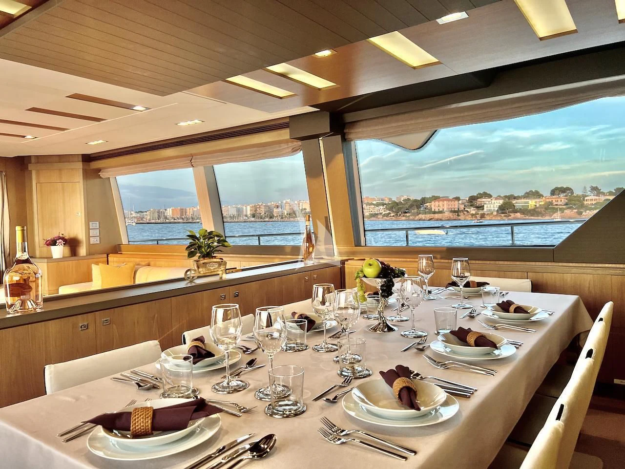 a table set for a dinner aboard NIKO III Yacht for Charter