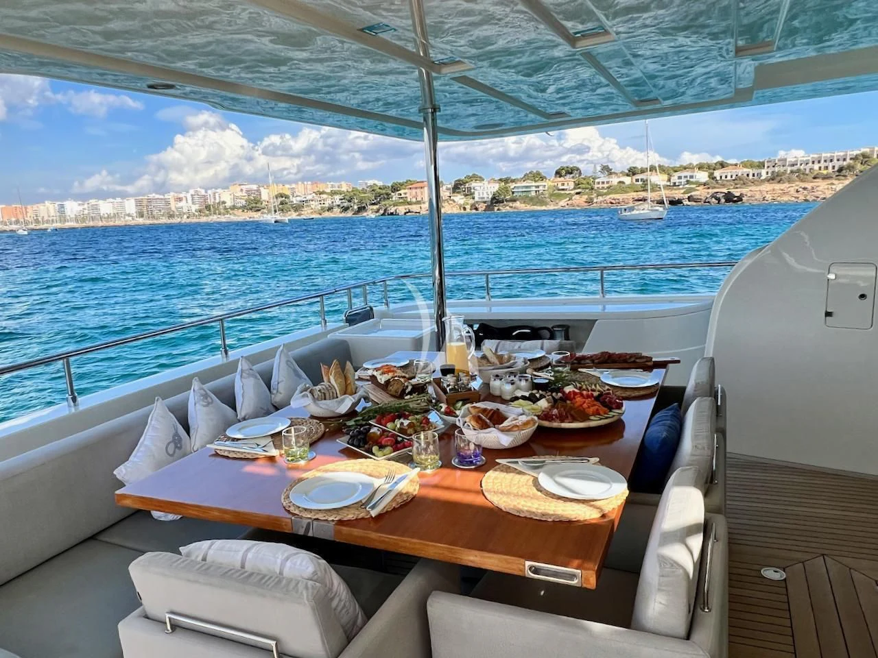 a table with food on it on a boat aboard NIKO III Yacht for Charter
