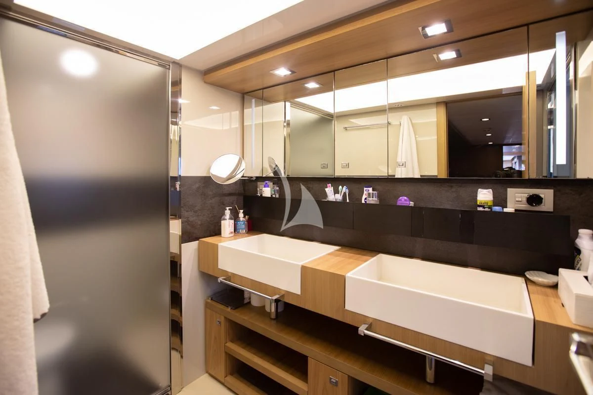 a bathroom with sinks and mirrors aboard NIKO III Yacht for Charter