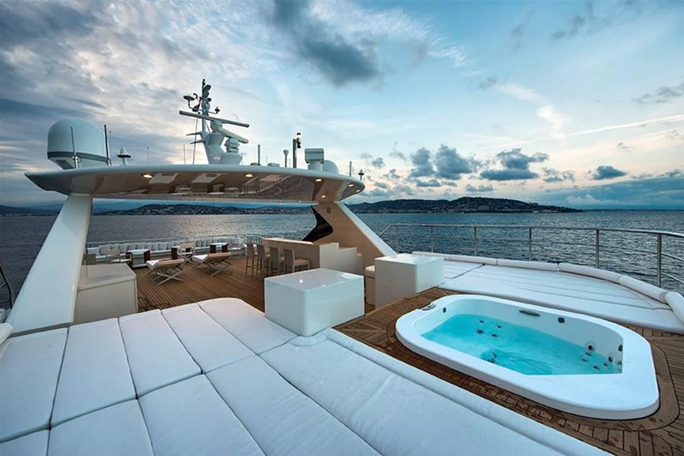 a large white pool with a drone flying over it aboard DARLING Yacht for Sale