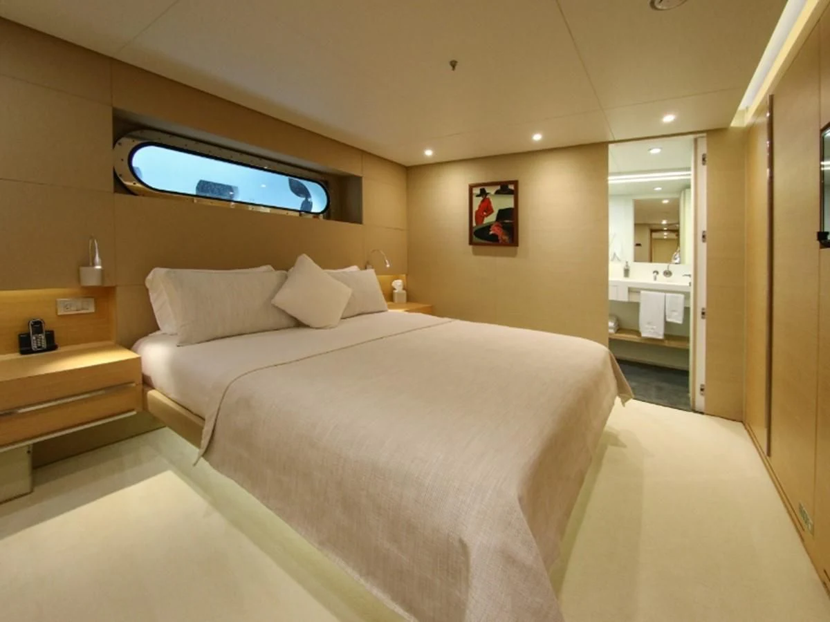 a hotel room with a bed aboard DARLING Yacht for Sale