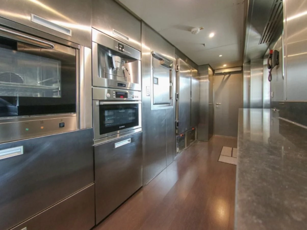 a large kitchen with stainless steel appliances aboard DARLING Yacht for Sale