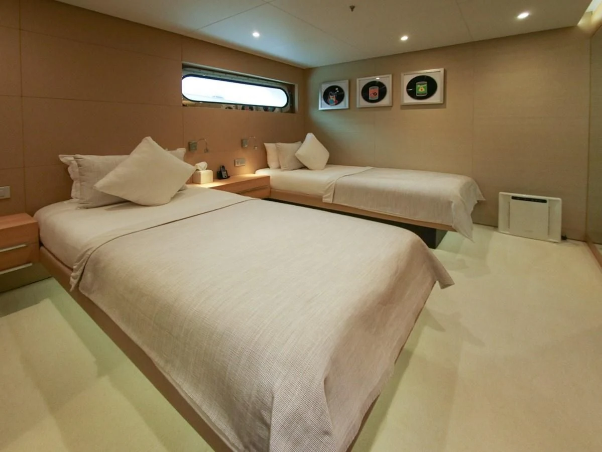 a room with two beds aboard DARLING Yacht for Sale