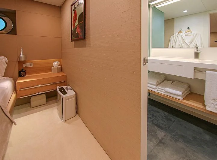 a bathroom with a sink and a mirror aboard DARLING Yacht for Sale