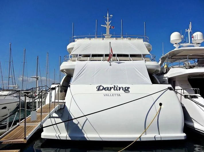 a white yacht docked aboard DARLING Yacht for Sale