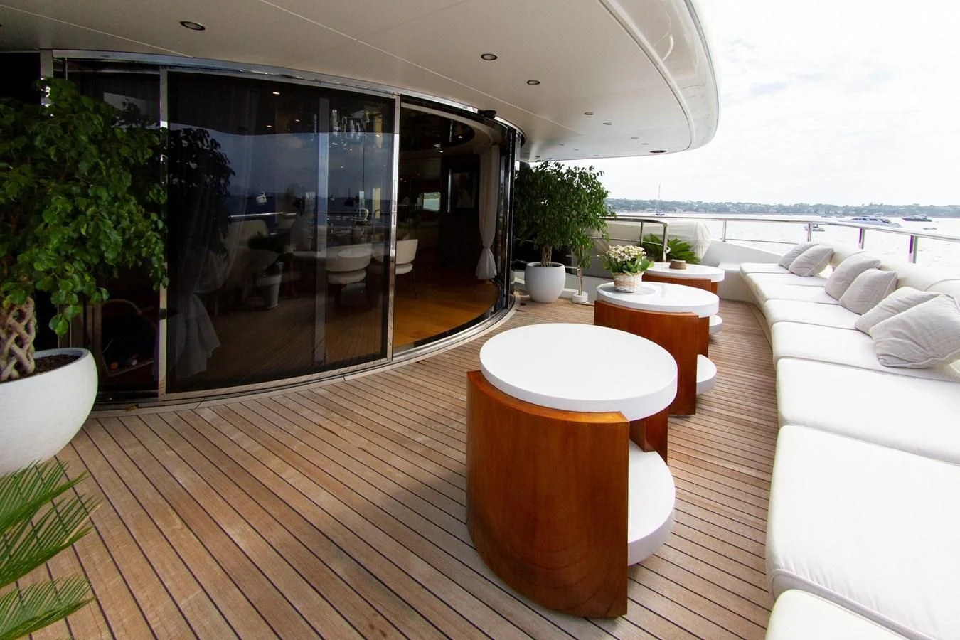 a room with a wood floor and a large glass door aboard DARLING Yacht for Sale