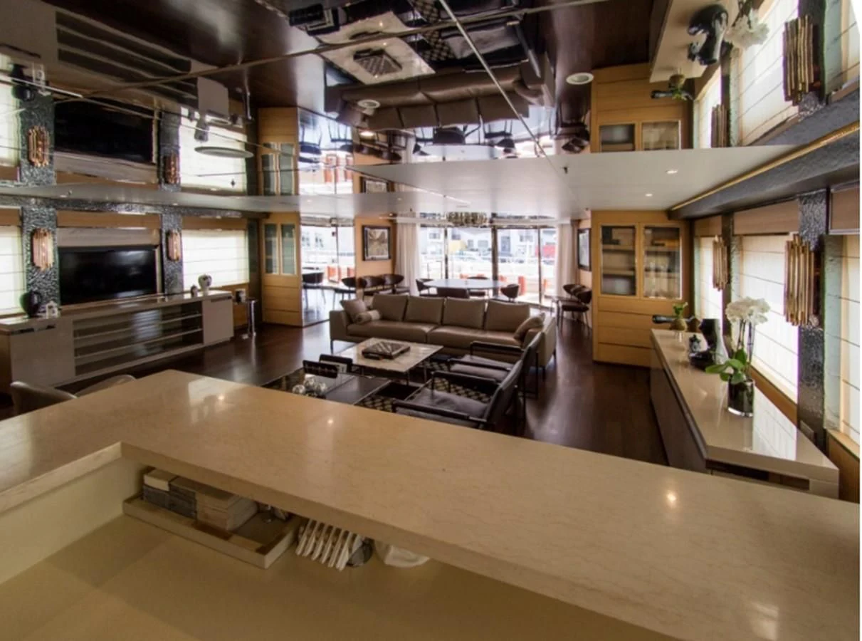 a large room with a large table and chairs aboard DARLING Yacht for Sale