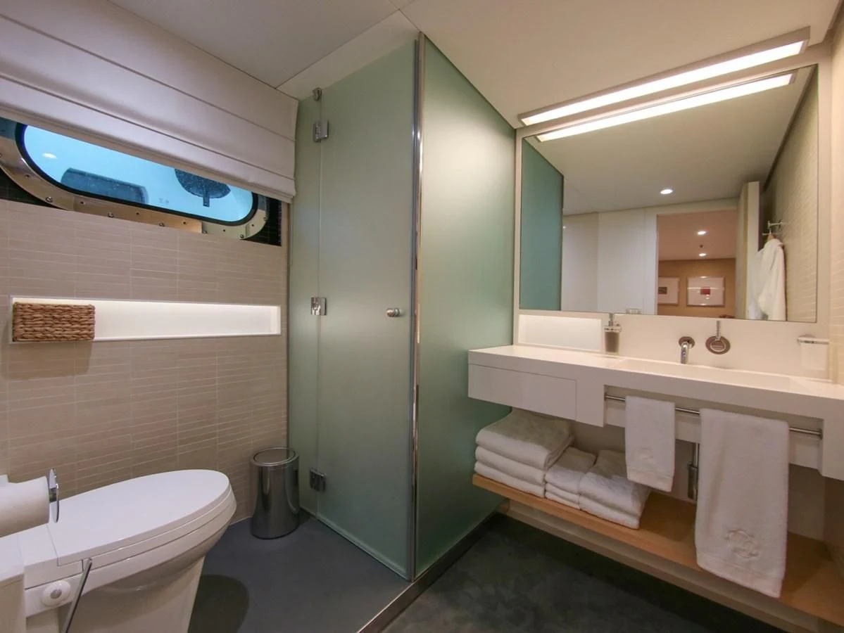 a bathroom with a glass shower aboard DARLING Yacht for Sale