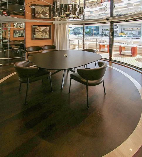 a table and chairs in a room aboard DARLING Yacht for Sale