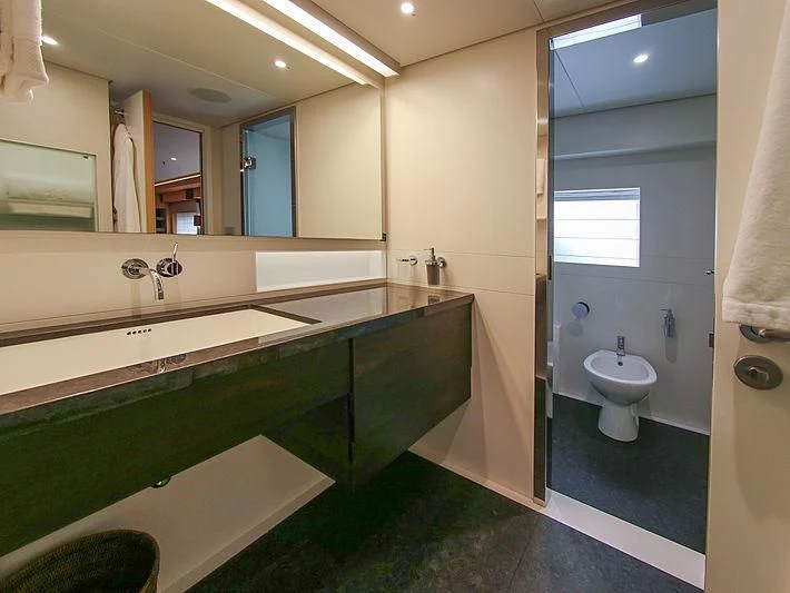 a bathroom with a large mirror aboard DARLING Yacht for Sale