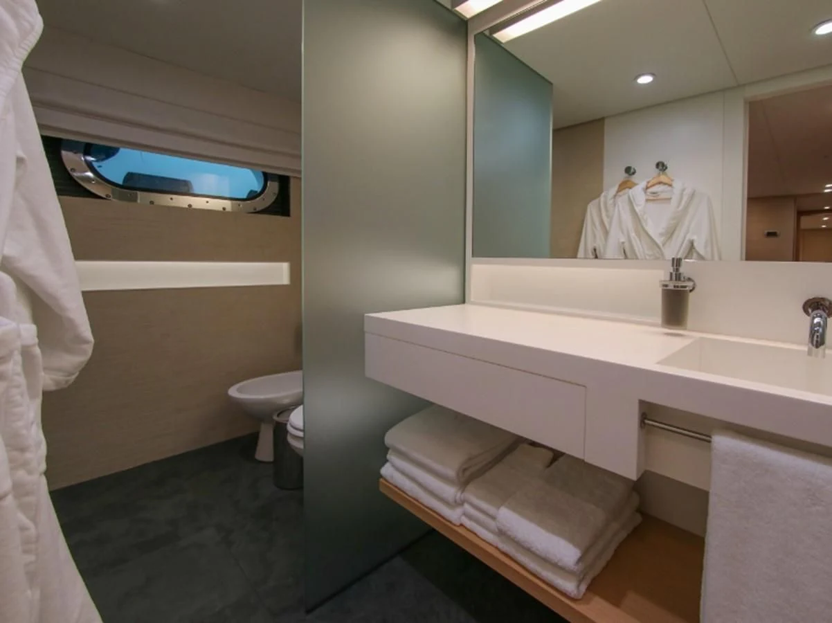 a bathroom with a large mirror aboard DARLING Yacht for Sale