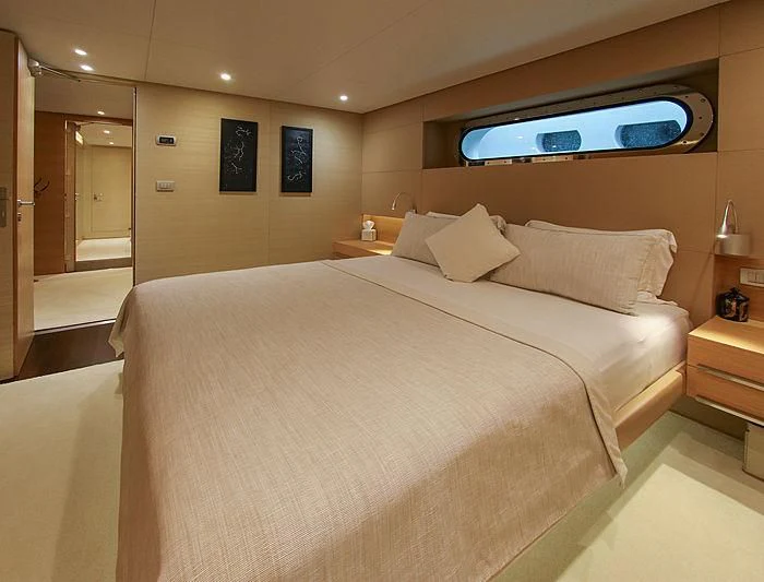 a hotel room with a bed aboard DARLING Yacht for Sale
