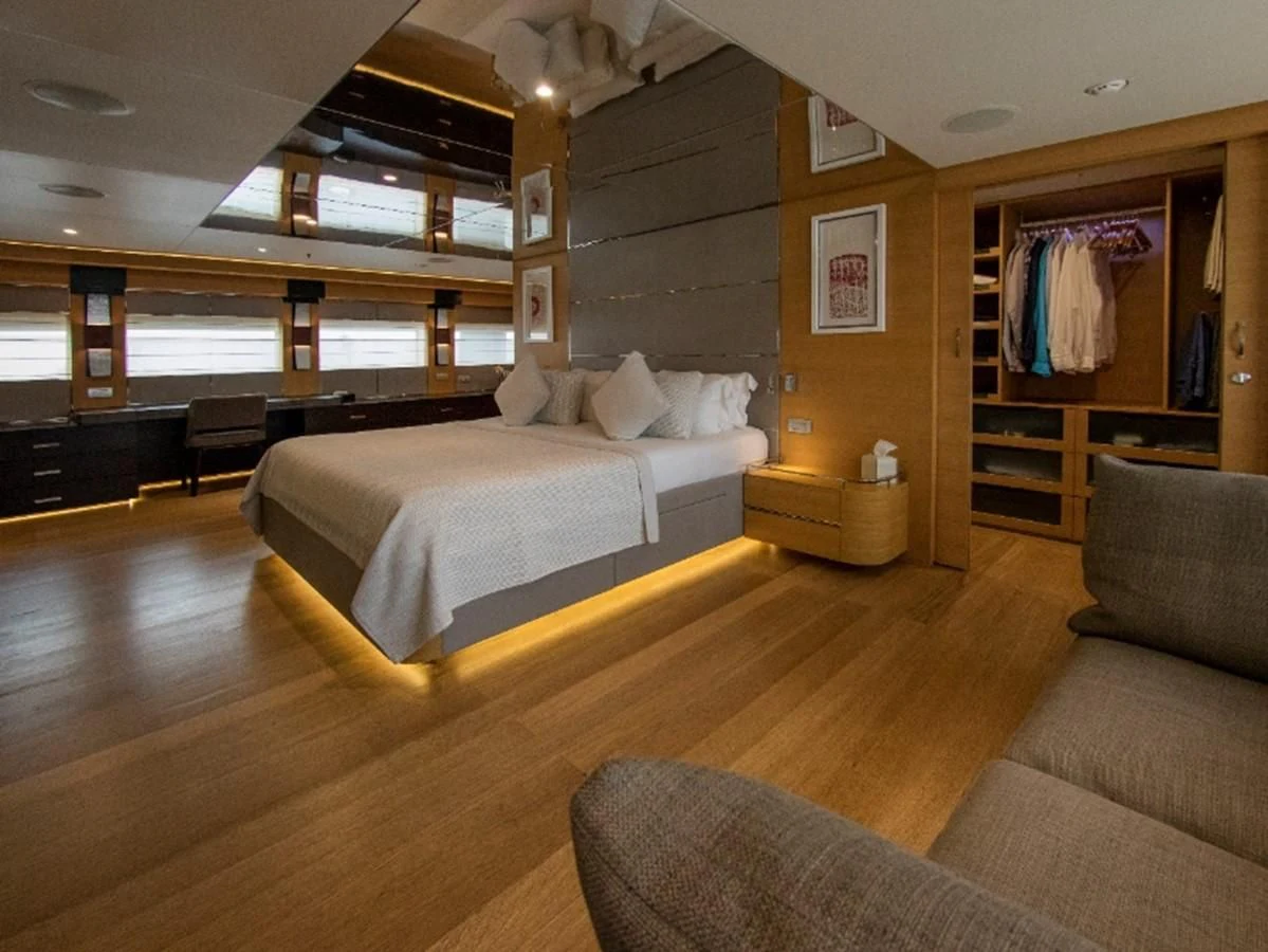a large bedroom with a large bed aboard DARLING Yacht for Sale