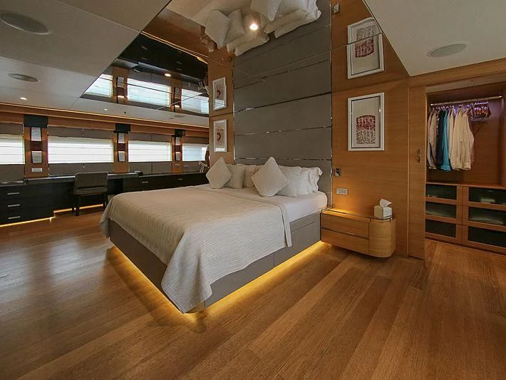a bedroom with a bed and a closet aboard DARLING Yacht for Sale