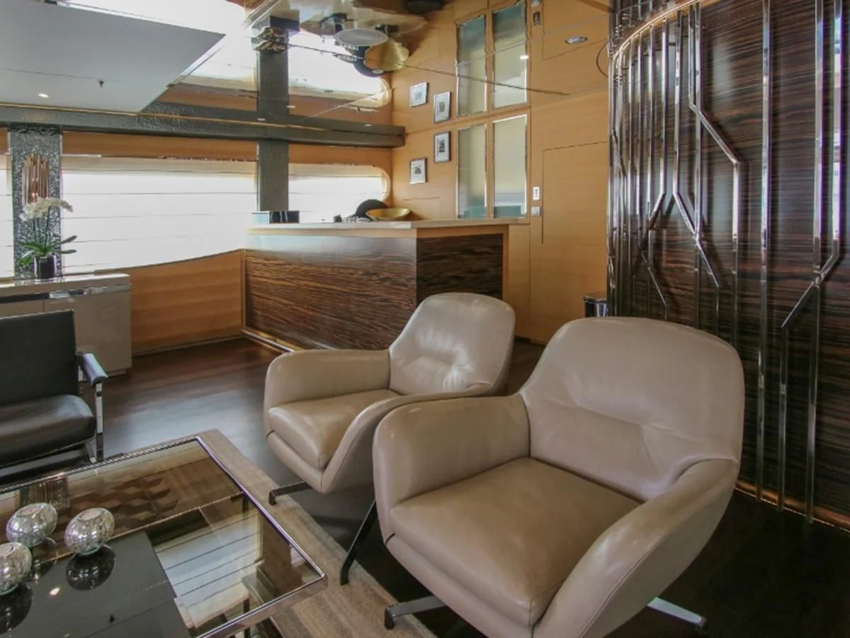 a living room with a staircase aboard DARLING Yacht for Sale