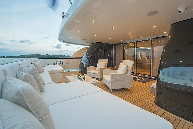 a room with a bed and a chair aboard DARLING Yacht for Sale