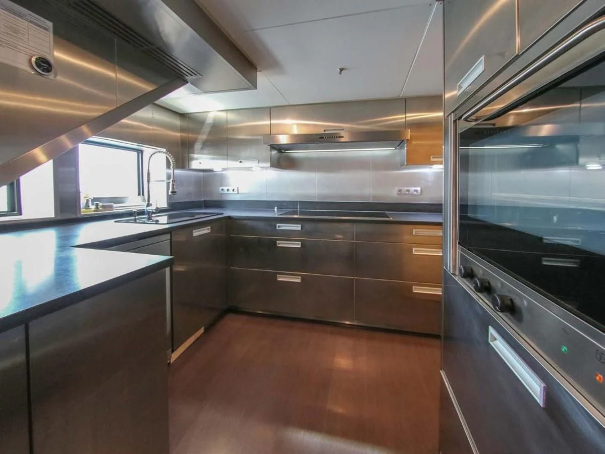 a kitchen with a large window aboard DARLING Yacht for Sale