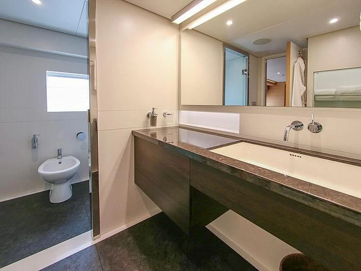 a bathroom with a large mirror aboard DARLING Yacht for Sale