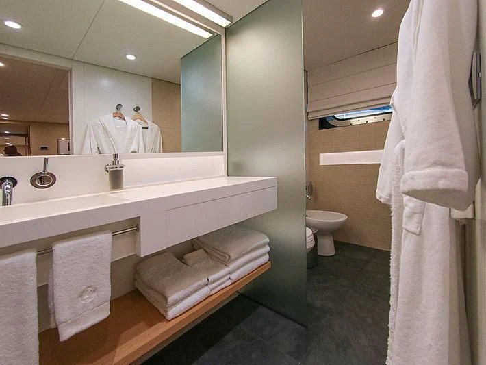 a bathroom with a large mirror aboard DARLING Yacht for Sale