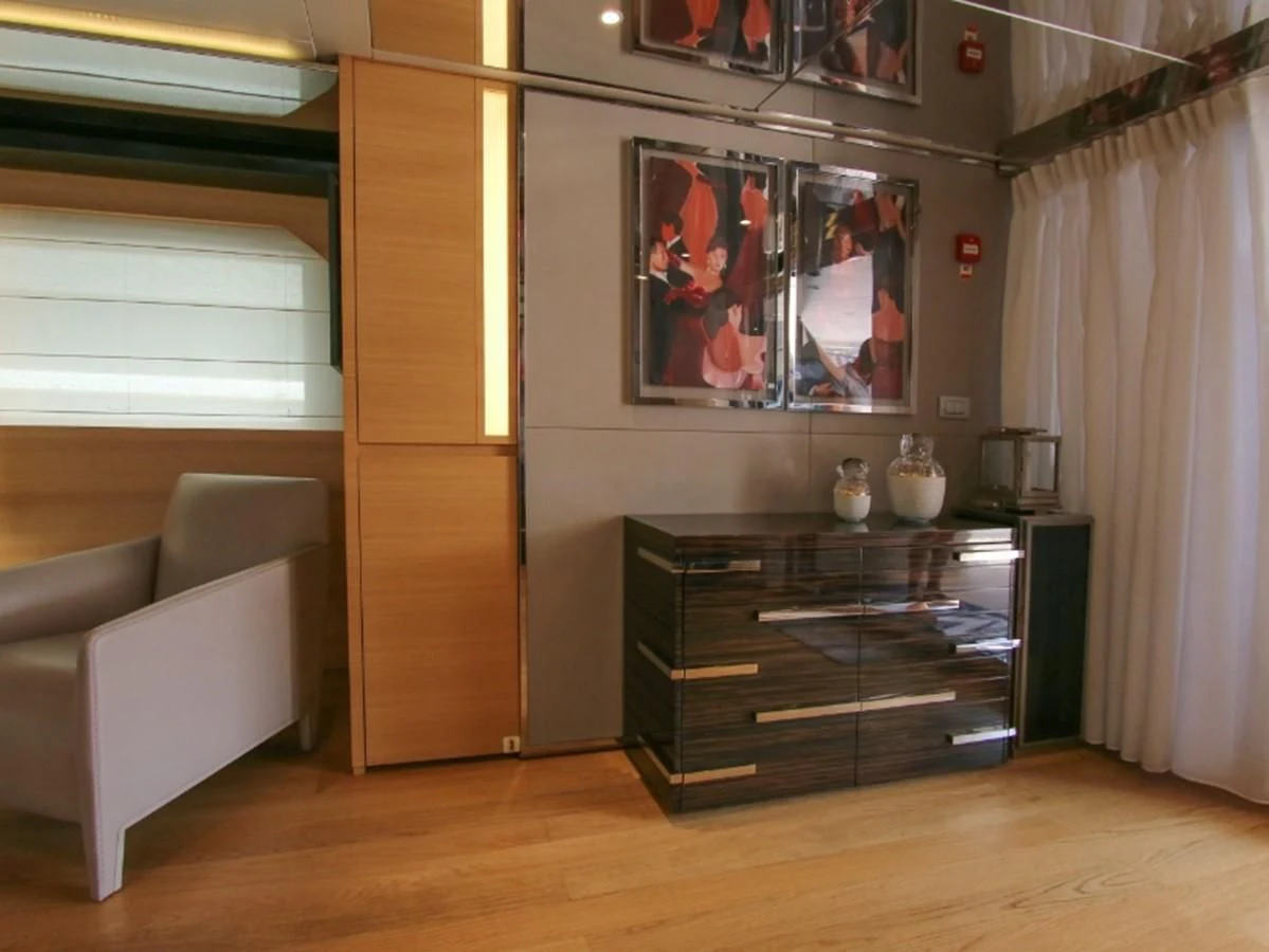 a room with a couch and a television aboard DARLING Yacht for Sale