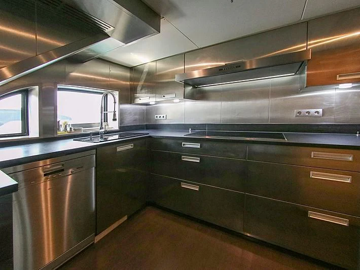 a kitchen with stainless steel appliances aboard DARLING Yacht for Sale